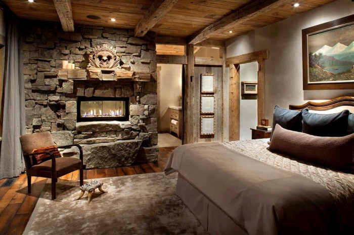 Cozy rustic bedrooms amazing bedroom wood fireplace stone walls romantic styled getaway mountain feel like chandelier clad ceiling complete check